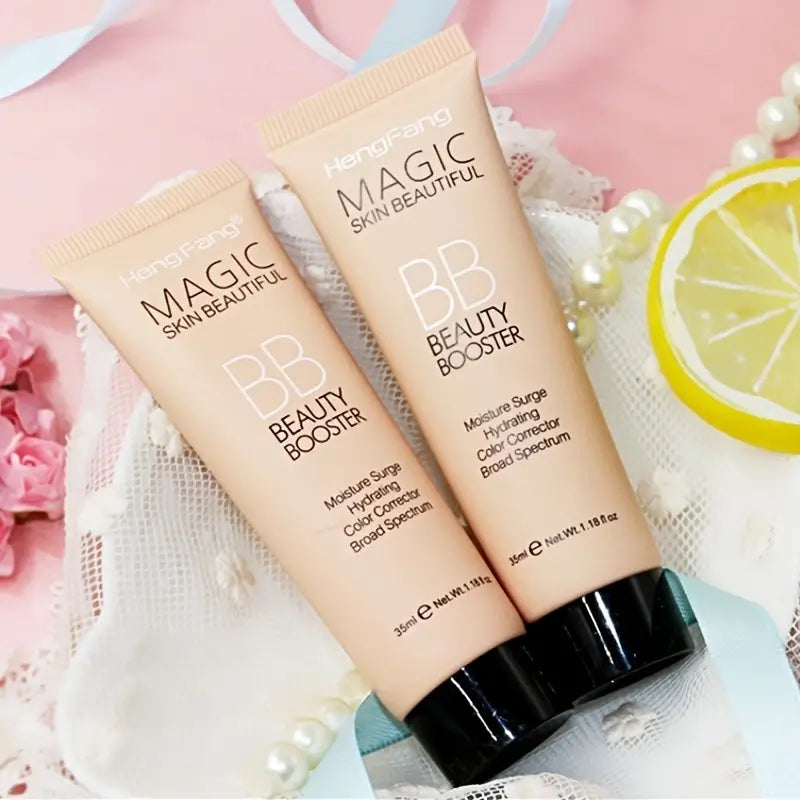Two BB beauty booster tubes with decorative background